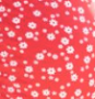 Rood en wit zwangerschapsbadpak met fijne bloemen en strik aan de achterkant
